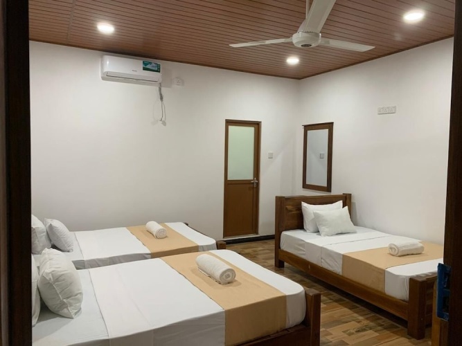 Standard Triple room with balcony and with garden view