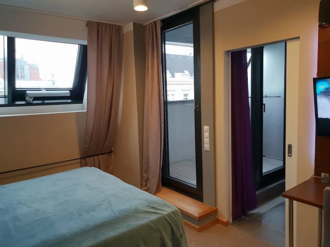 1 Bedroom Deluxe Quadruple room with balcony and with city view