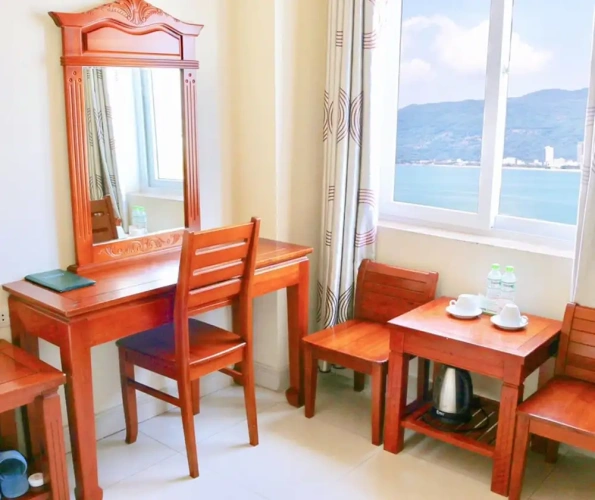 Deluxe Triple room with balcony and with partial ocean view