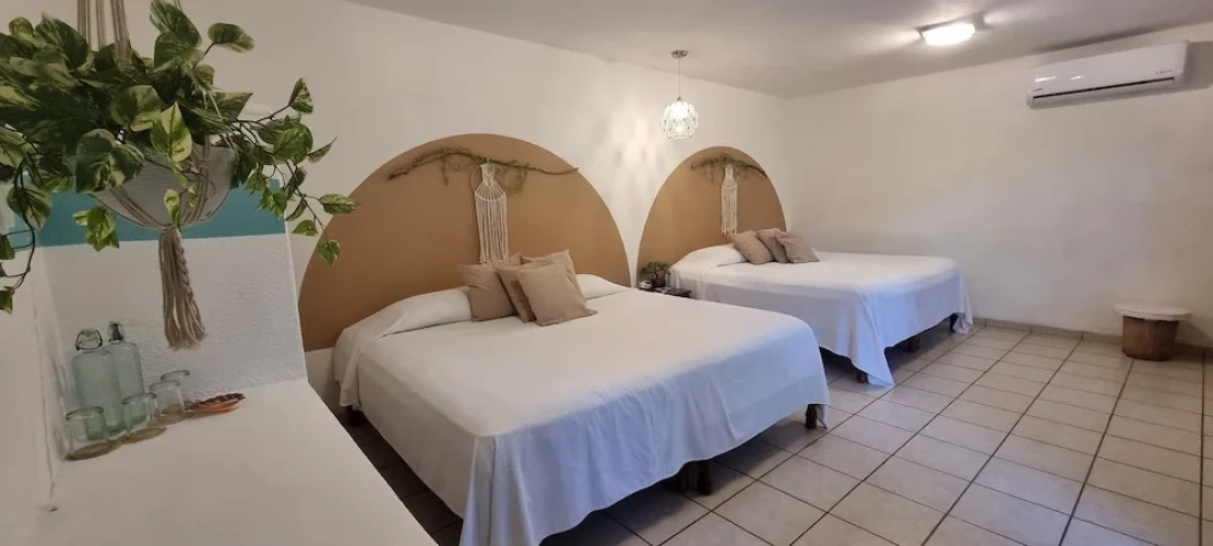 Standard Quadruple room with garden view