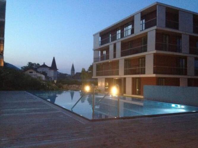 Apartment pool and lakeOver view