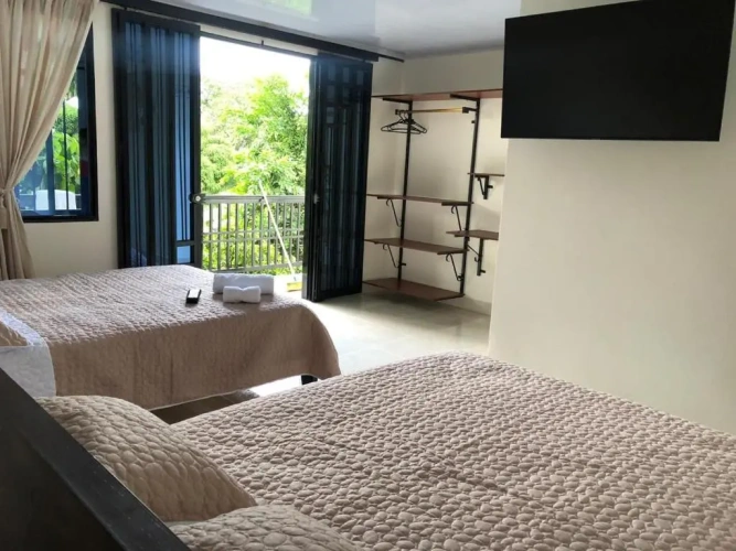Standard Quadruple room with garden view