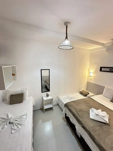 Standard Quadruple room with partial sea view