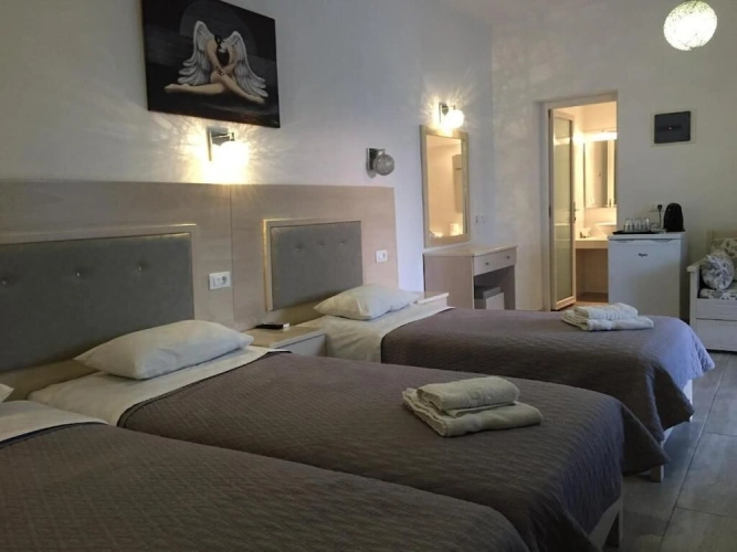 Standard Quadruple room with balcony and with garden view