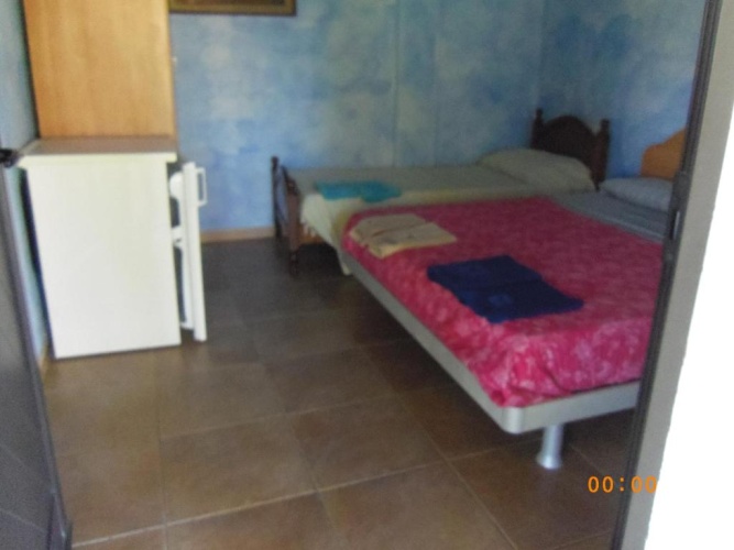 Standard Triple room with garden view