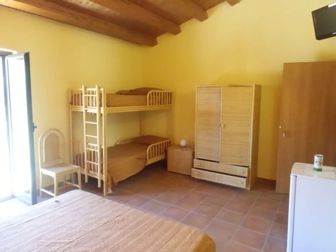 Standard Quadruple room with balcony and with garden view