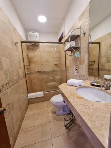 Standard Triple room with balcony and with garden view