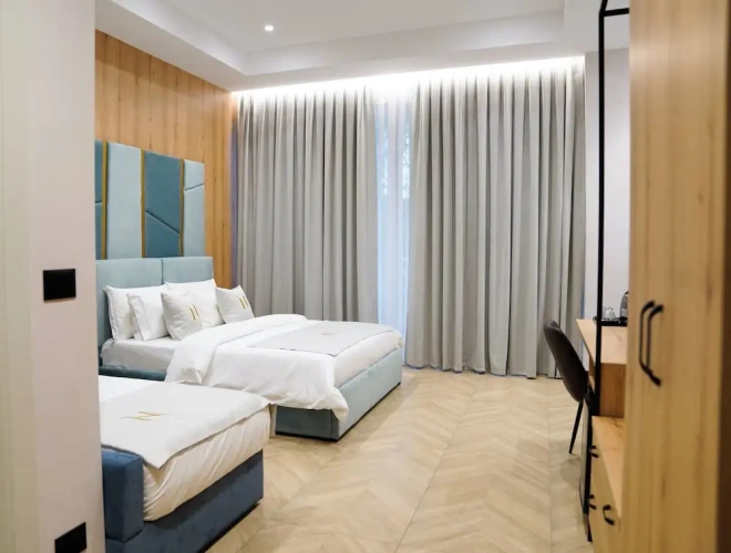 Deluxe Quadruple room with balcony and with city view