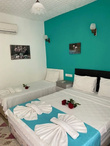 Standard Triple room with balcony and with garden view