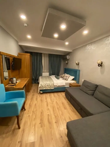 Deluxe Quadruple room with balcony