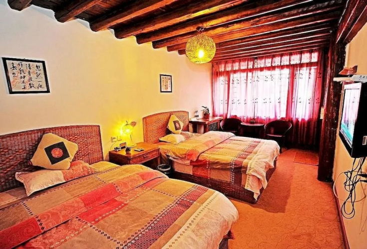 Lijiang Caicaijia Inn