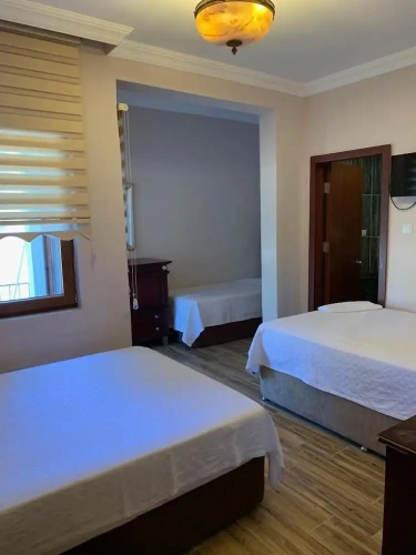 Classic Quadruple room with garden view