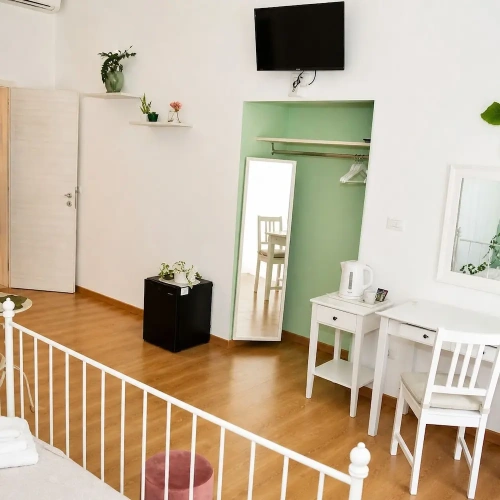 Standard Quadruple room with balcony and with city view