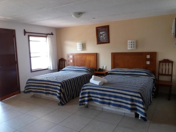Standard Quadruple room with garden view