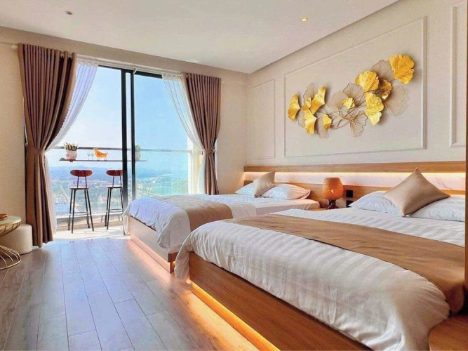 Deluxe Quadruple room with balcony and beachfront
