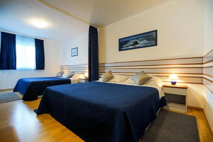Standard Quadruple Family room with balcony and with partial sea view