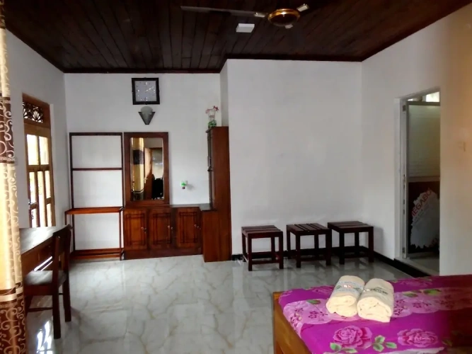 Standard Triple room with garden view