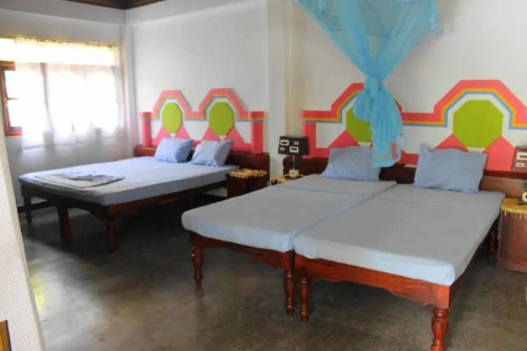 Standard Quadruple room with balcony and with garden view