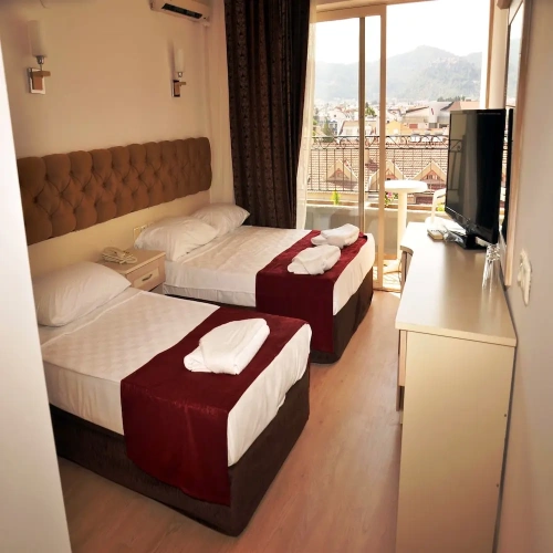 Standard Quadruple room with balcony and with city view