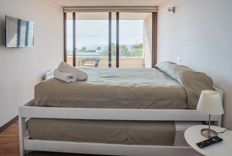 Contemporary apartment w/ a full kitchen, ocean views, & rooftop deck