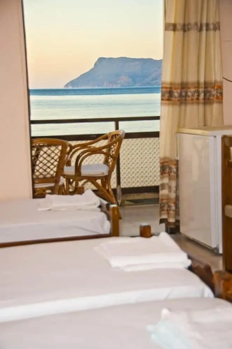 Standard Quadruple room with balcony and beachfront