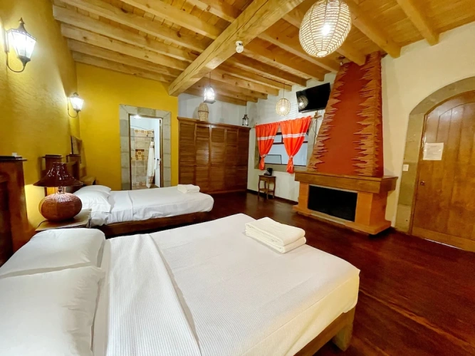 Standard Quadruple Family room with courtyard view