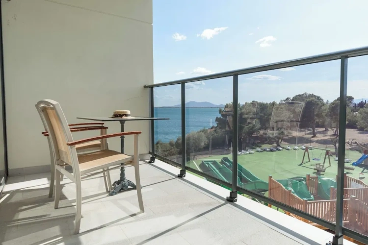 Standard Quadruple room with balcony and with partial sea view