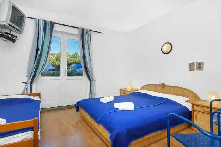 Standard Triple room with balcony and with garden view