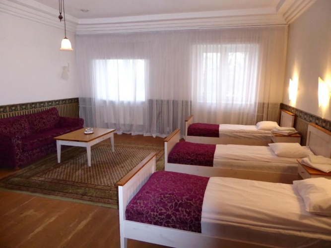 Standard Quadruple room with garden view