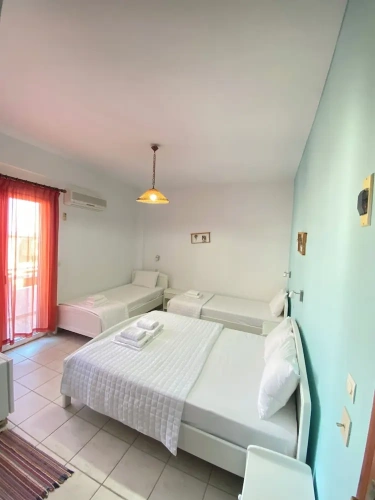 Standard Quadruple room with balcony and with partial sea view