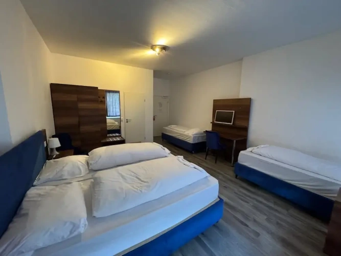 Standard Quadruple room with balcony and with courtyard view