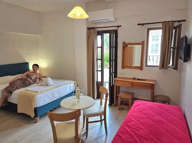 Standard Triple room with balcony and with garden view