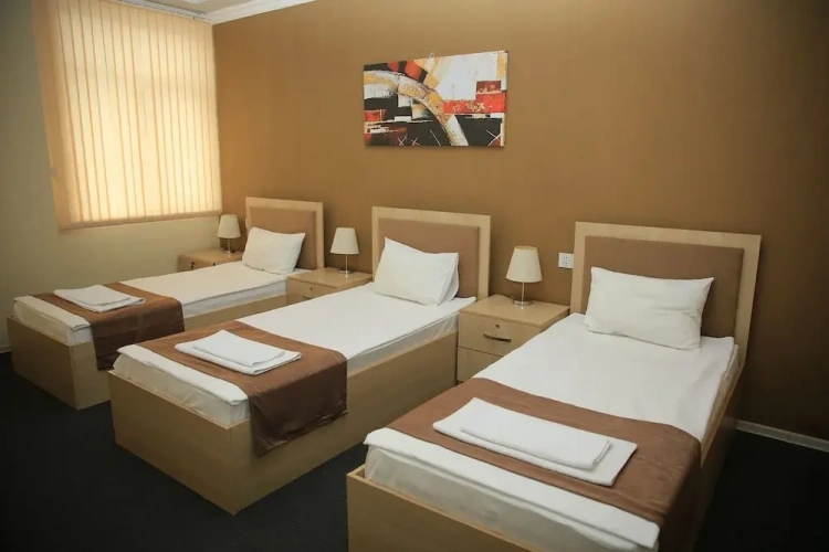 Standard Quadruple room with garden view