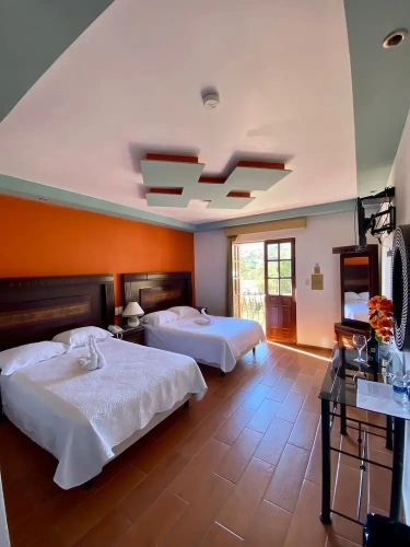 Grand Quadruple room with balcony and with mountain view