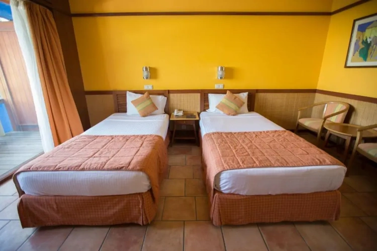 Standard Triple room with side sea view