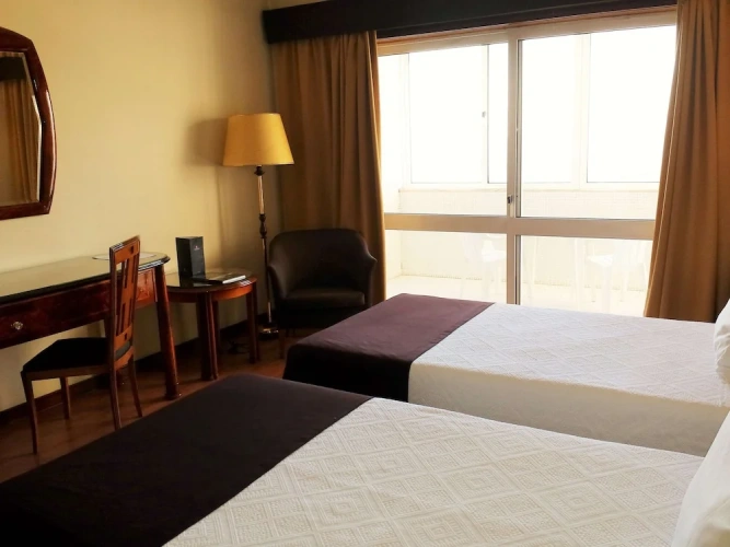 Standard Twin room with balcony and with city view