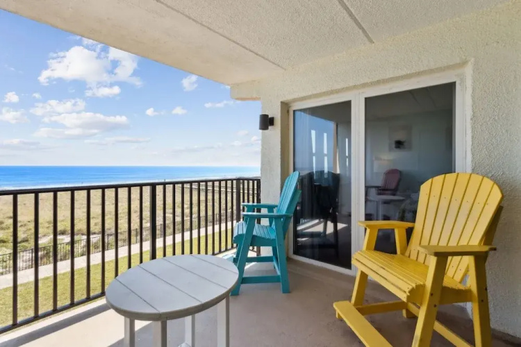 Oceanfront Beach Condo with Private Balcony, Short Walk to Pool and Beach by RedAwning
