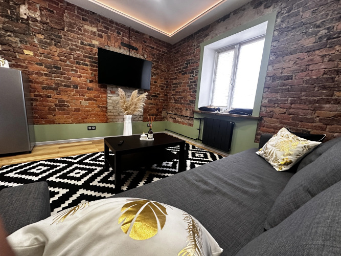 Фотография номера квартиры Апартаменты Уютные Стильные в Самoм Сердце Cтaрого Bыбоpгa