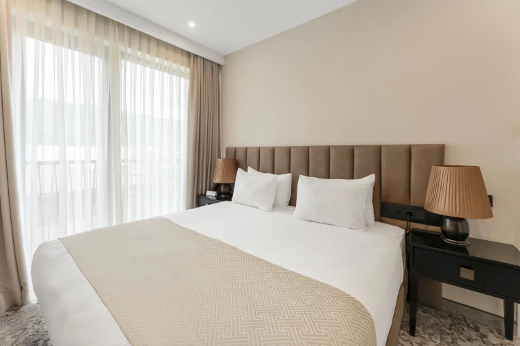 Deluxe Quadruple room with balcony and with garden view
