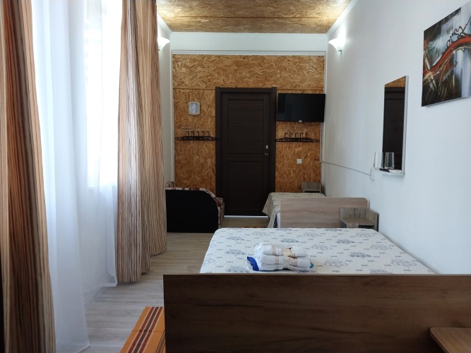 Standard Quadruple room with courtyard view