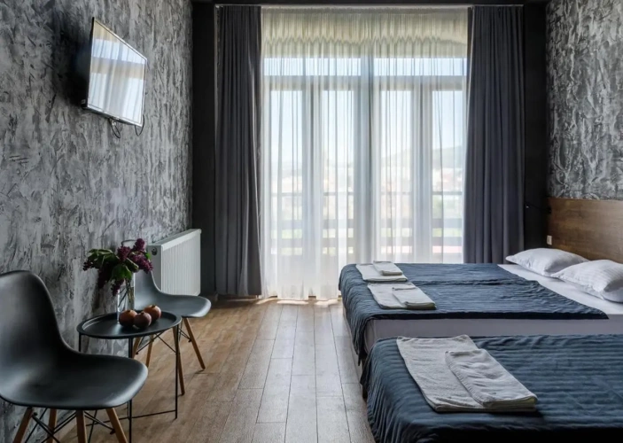 Standard Triple Family room with balcony and with city view