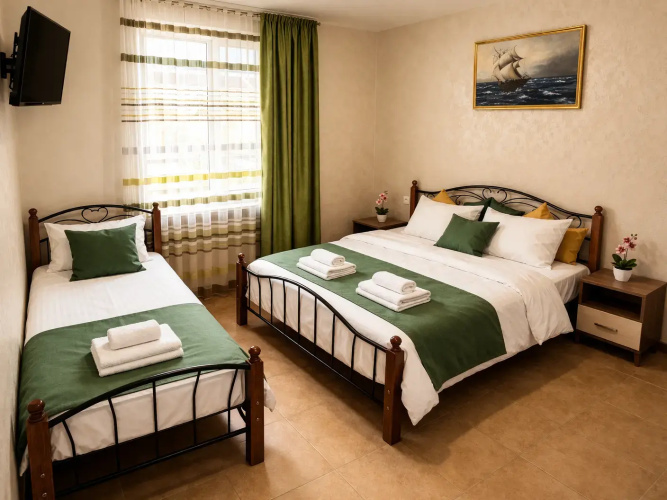 Standard Triple room with balcony and with courtyard view