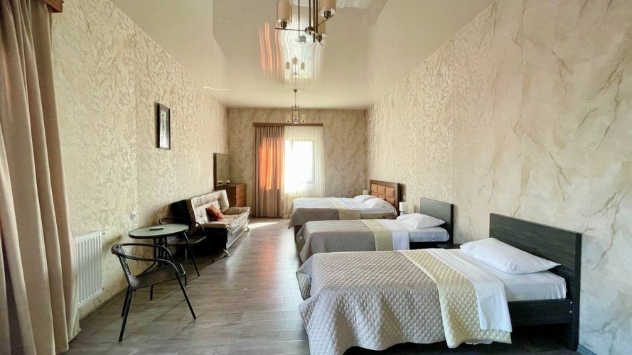 Deluxe Quadruple room with balcony and with view
