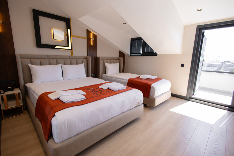 Standard Triple Family room with balcony and with city view