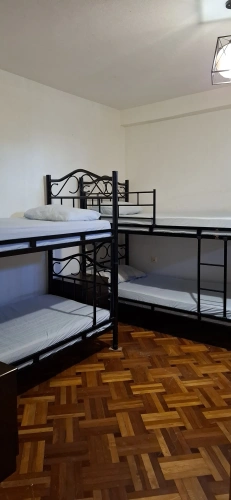 Bed in Dorm with courtyard view