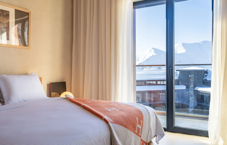 Фотография номера квартиры Апартаменты Просторные апартаменты с 2 спальнями и 2 ванными в здании NEO ski-in/ski-out Новый Гудаури