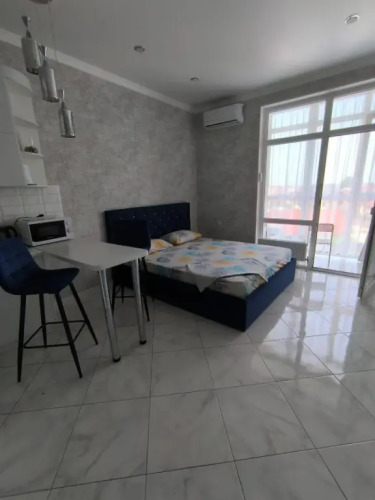 Фотография номера квартиры Квартира Уютная студия в районе Северного парка