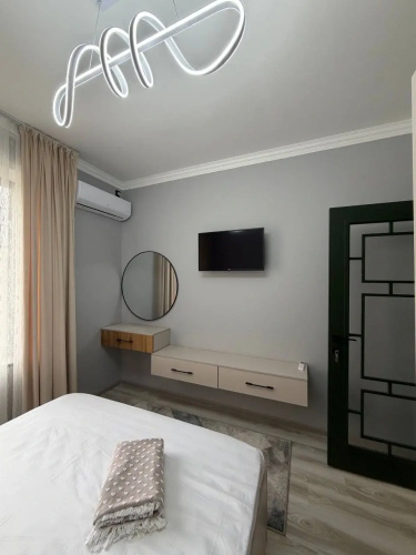 V Tsentre Goroda Apartments
