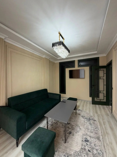 V Tsentre Goroda Apartments