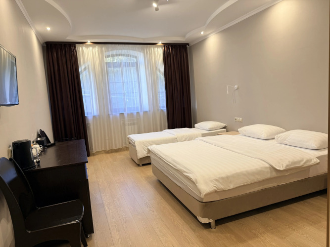 Фотография номера гостиницы Тройка